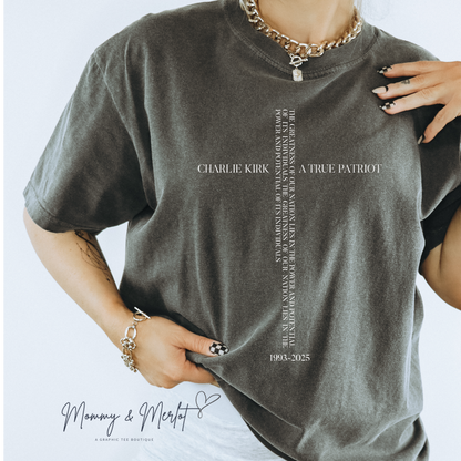 Person wearing a gray t-shirt with text and branding on a light gray background